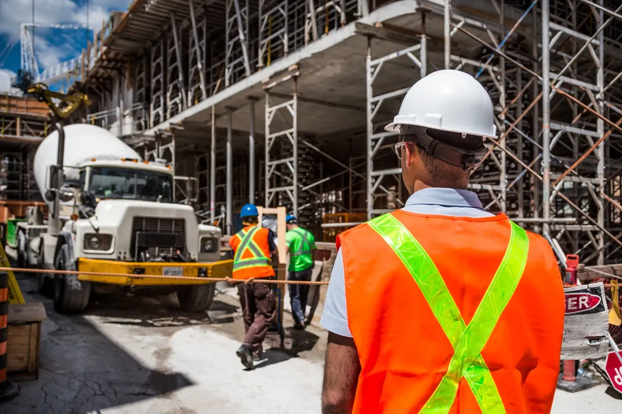 Construction worker in safety vest at job site